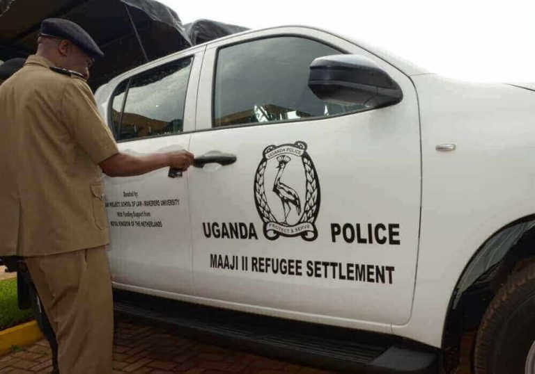 IGP Okoth Ochola opens a car donated by RLP through Embassy of the Netherlands in Uganda